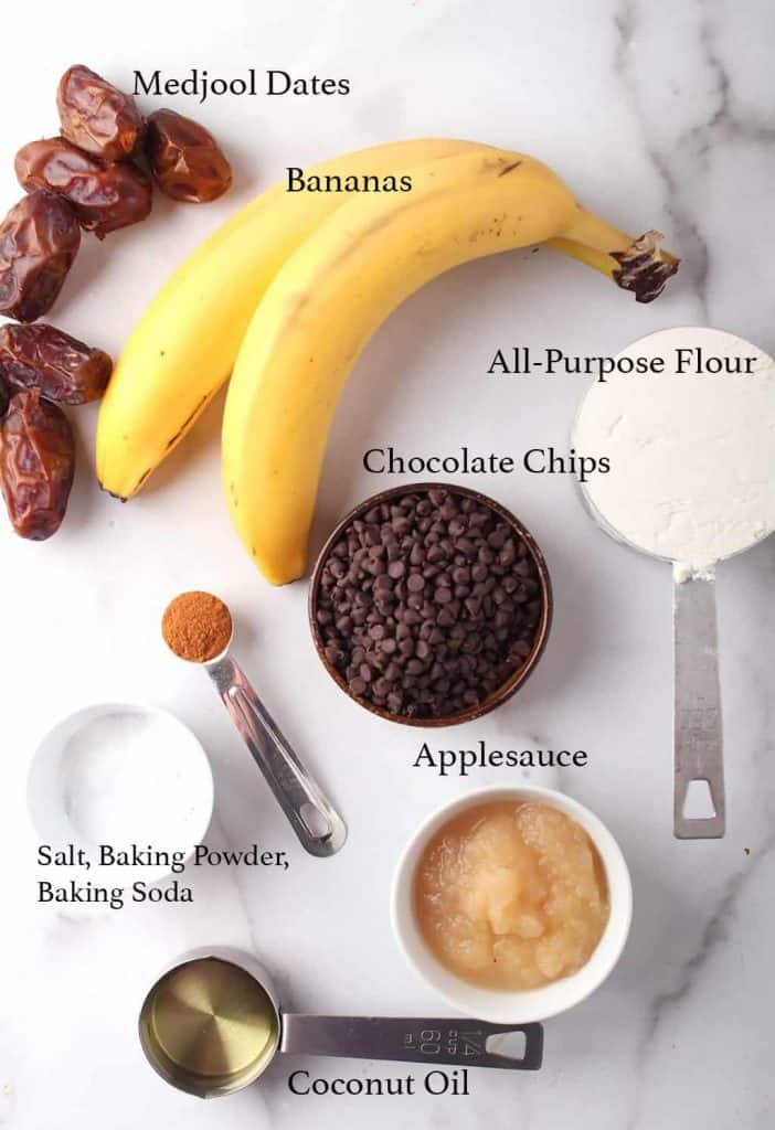 Ingredients for banana muffins on a marble top