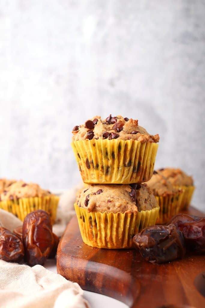 Two finished muffins stacked on top of one another