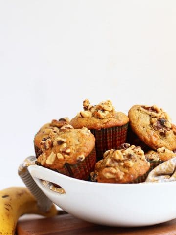 Finished muffins stacked inside a white bowl