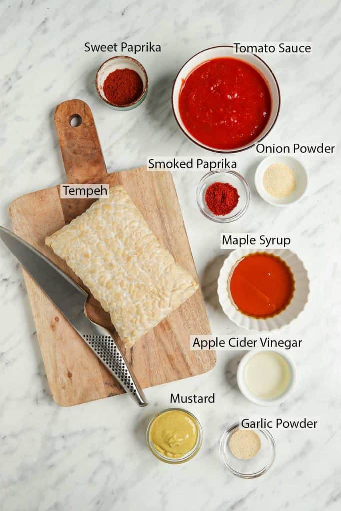 vegan ribs with tempeh recipe ingredients: tempeh, smoked paprika powder, maple syrup, apple cider vinegar, tomato sauce, vinegar, mustard, garlic powder and sweet paprika