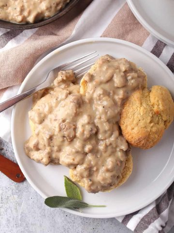 Finished biscuits and gravy on a white plate