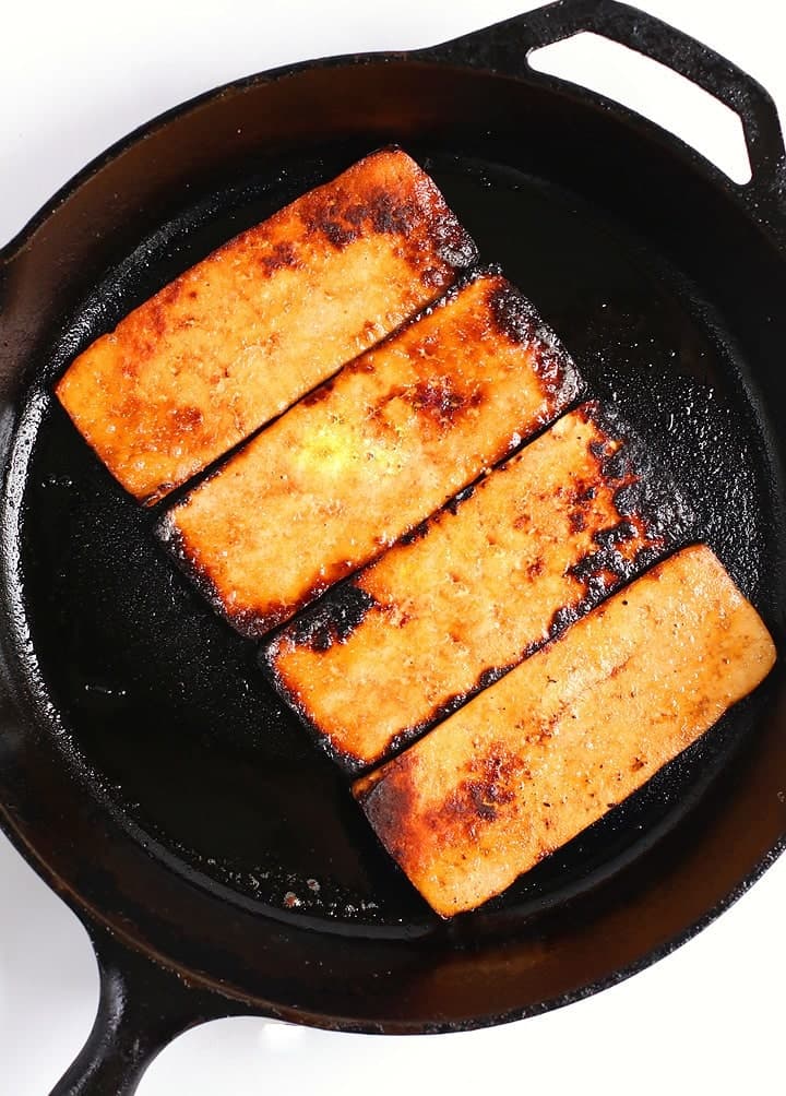 Pan fried tofu in a cast iron skillet