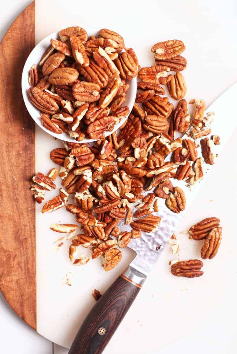 Chopped pecans on cutting board