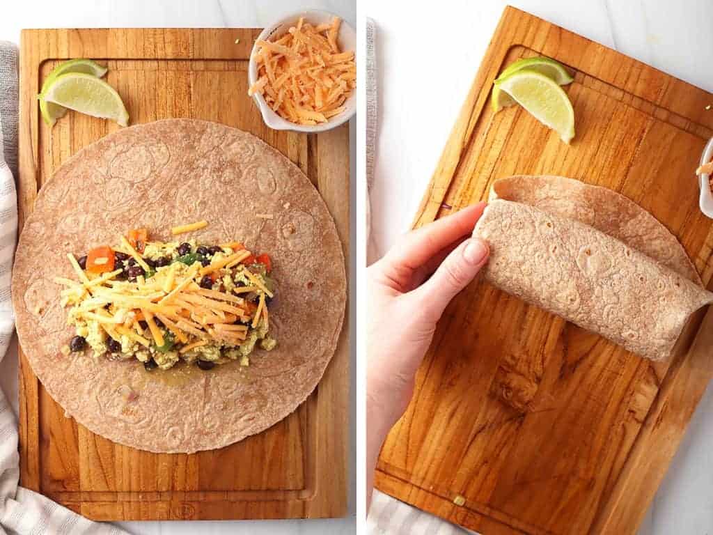 Breakfast burrito on a cutting board wrapped up