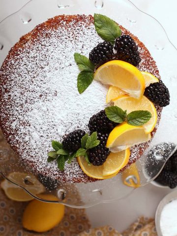 Whole cake with lemons and blackberries