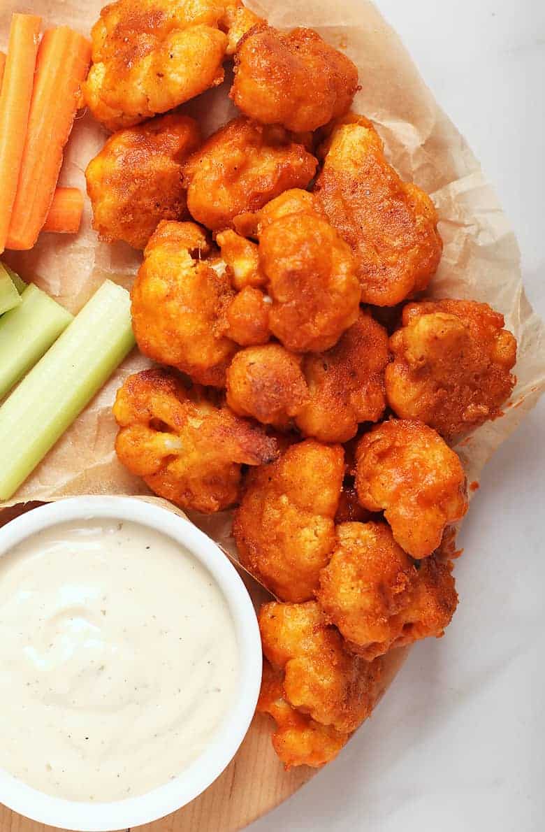 Cauliflower Buffalo Wings with ranch dressing and celery