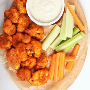 Buffalo Cauliflower Wings with ranch and carrot sticks