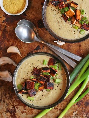 Two bowls of Cream of Cauliflower Soup