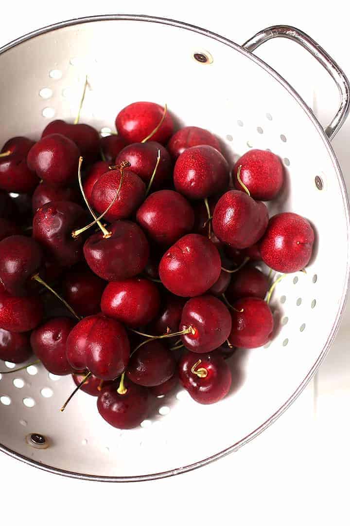 Bowl of fresh cherries in a colander
