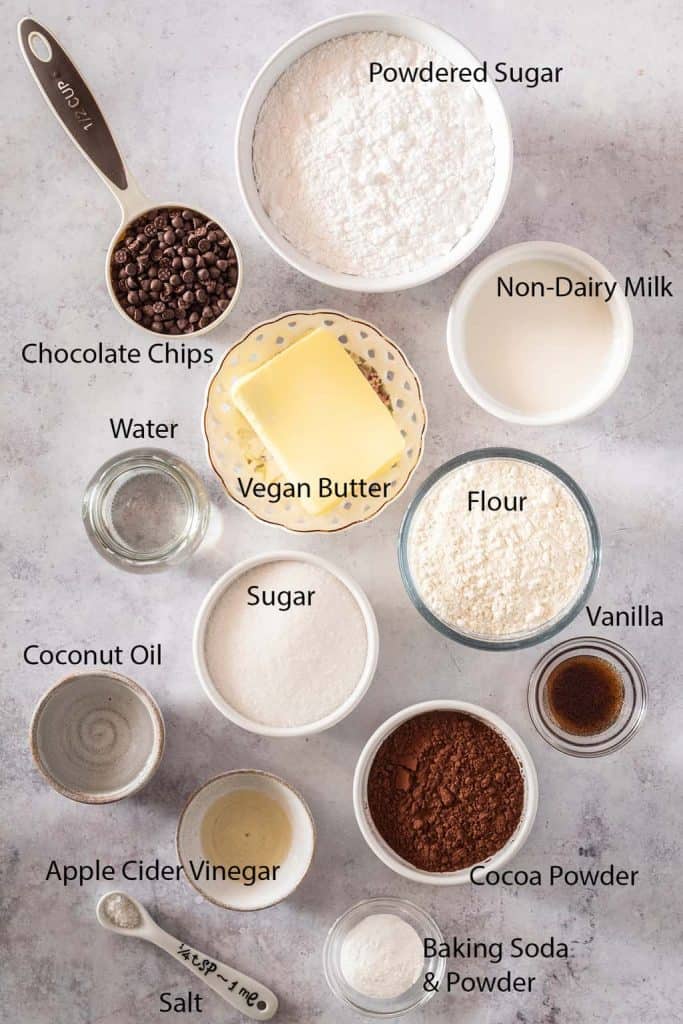Ingredients for vegan cupcakes measured out and placed on a marble countertop 