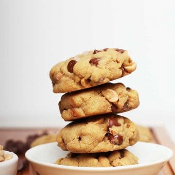 Stacked gluten free cookies in a white bowl