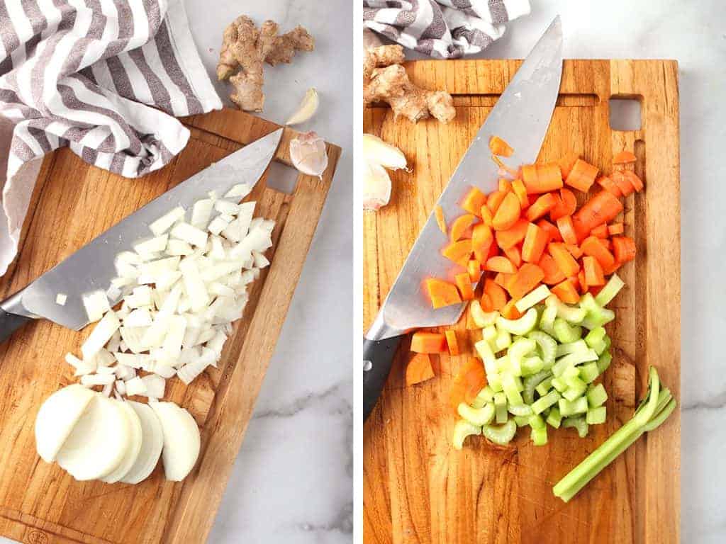 Chopped onions, carrots, and celery on a cutting board