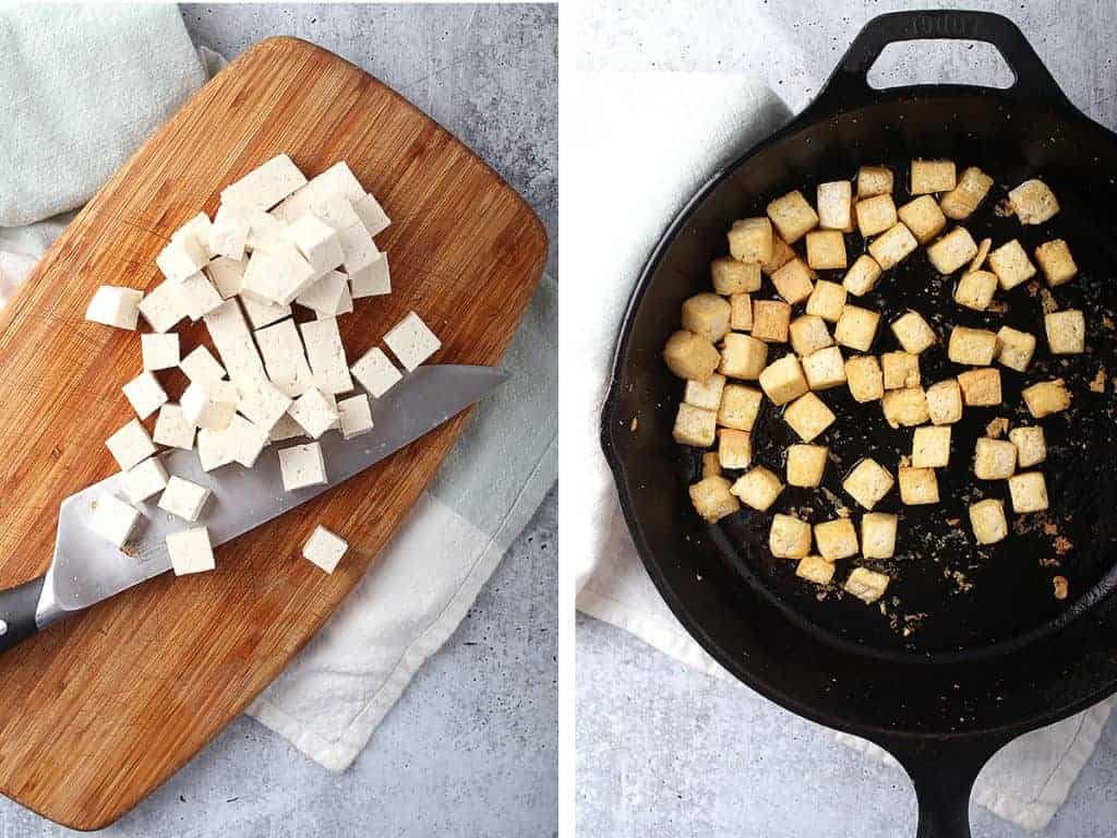Cubed and sautéed tofu in a cast iron skillet