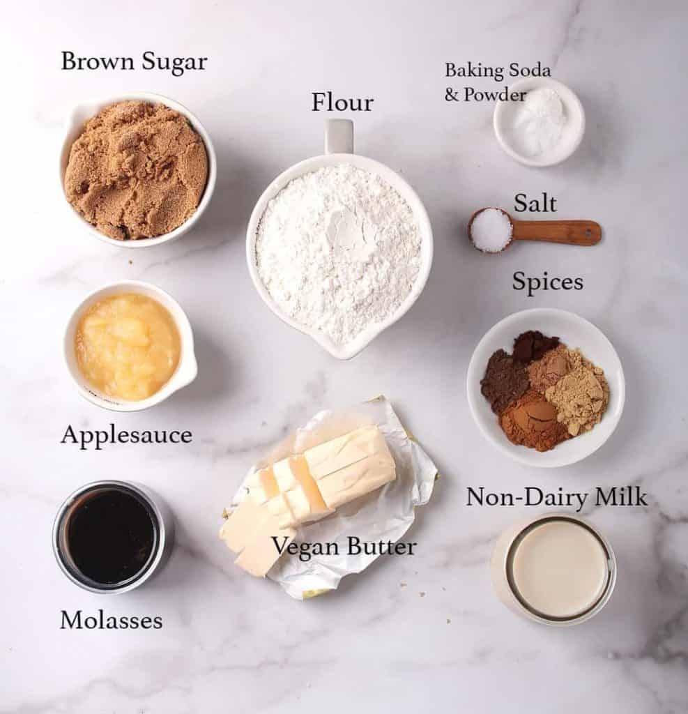 Ingredients for vegan bundt cake on a marble countertop 