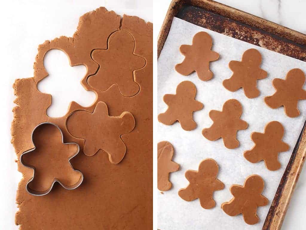 Gingerbread men cut out and placed on a parchment lined baking sheet