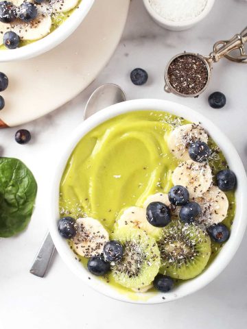 Close up of green smoothie bowl with bananas and blueberries