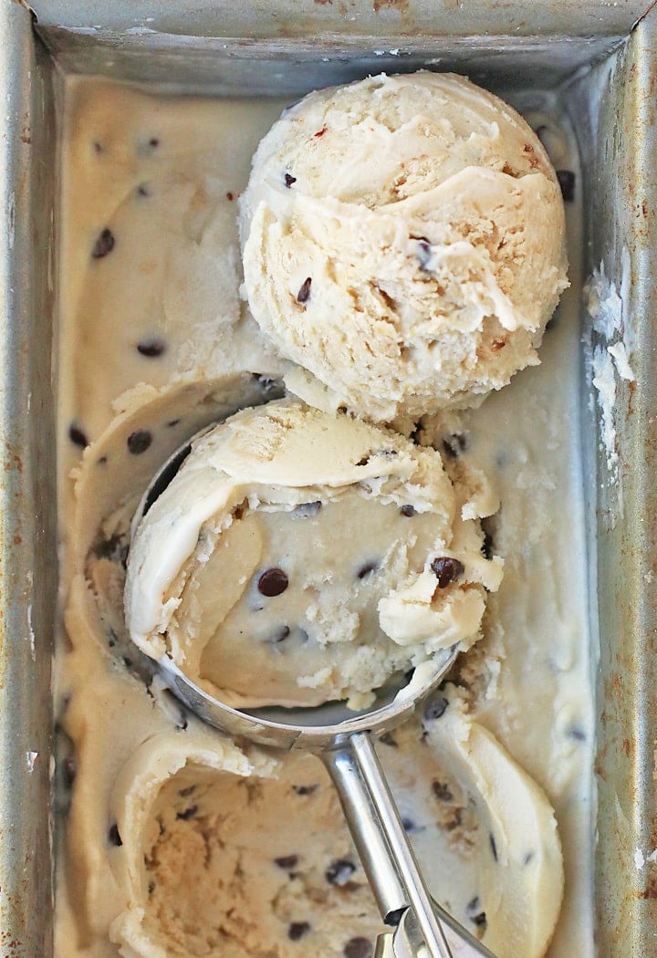 Homemade ice cream in a loaf pan with an ice cream scoop