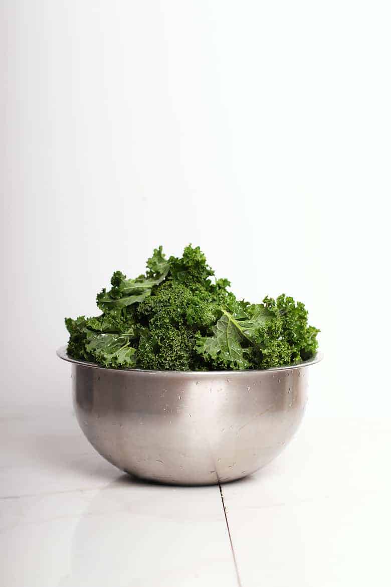 Curly kale in a metal bowl