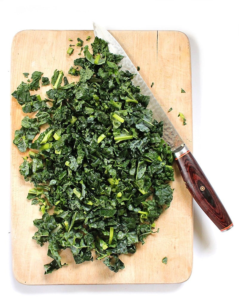 Chopped Kale on a cutting board with a knife