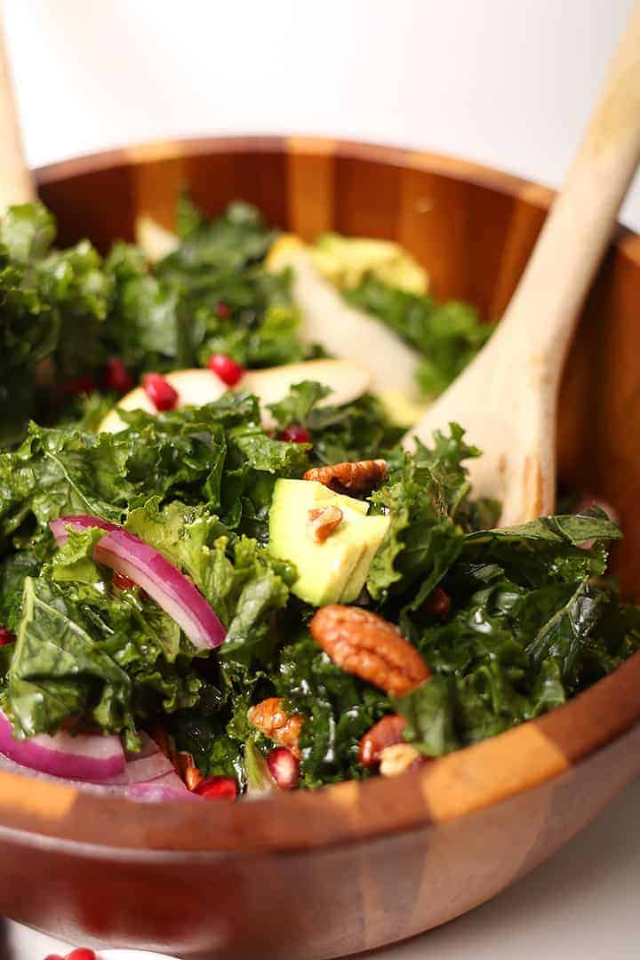 Winter Kale Salad in wooden salad bowl