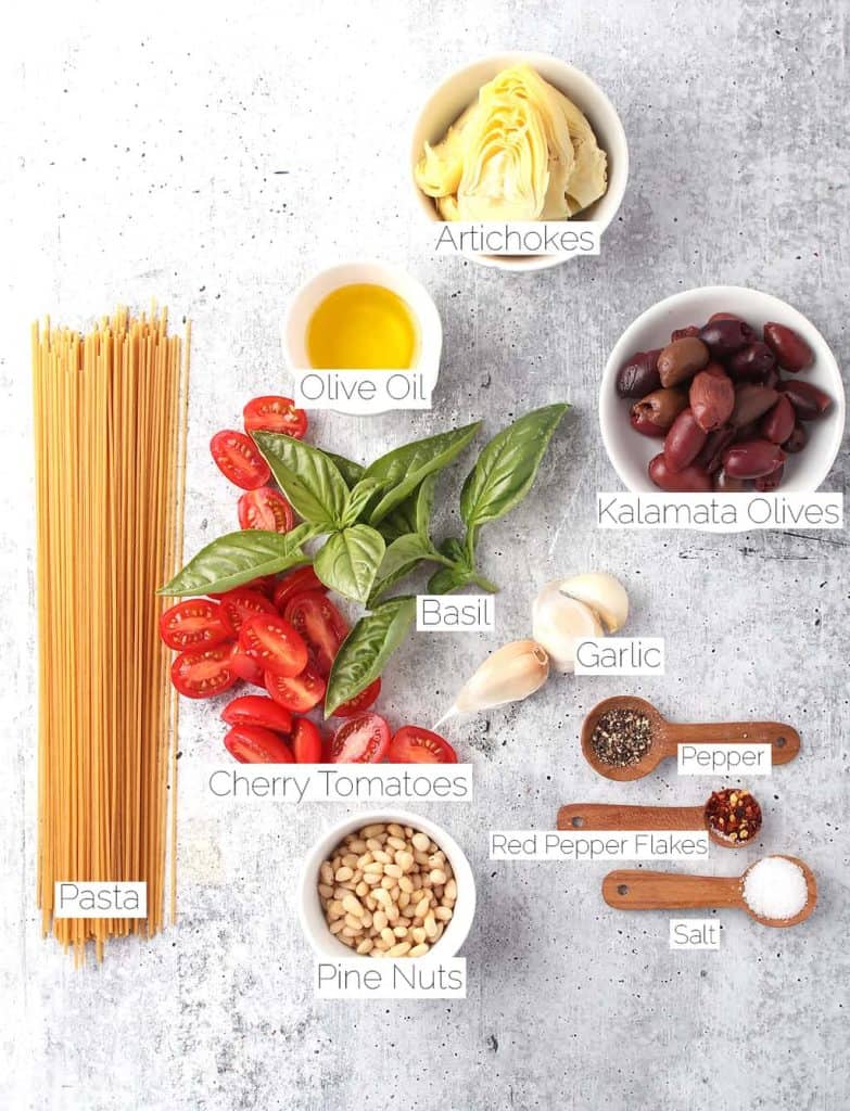 Ingredients for Mediterranean Pasta on a concrete countertop