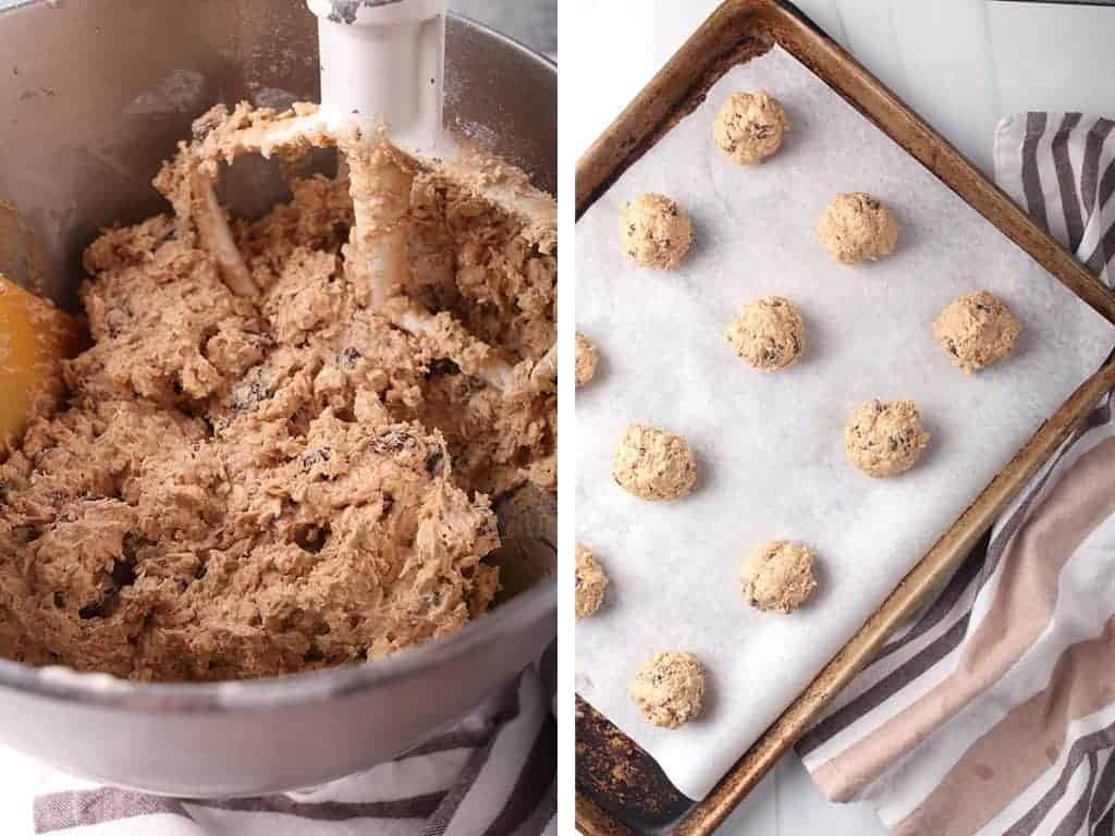 Oatmeal Raisin cookie dough rolled out into balls and placed on a baking sheet. 