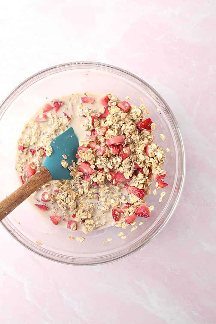 Oats, strawberries, and milk in a bowl