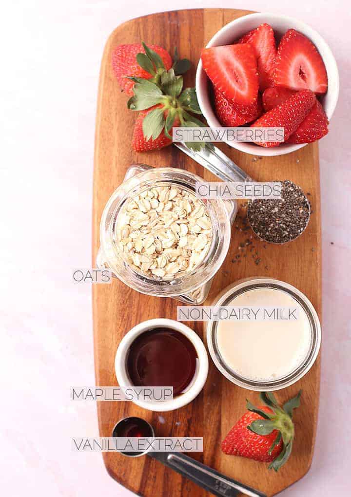 Ingredients for overnight oats on a wooden board