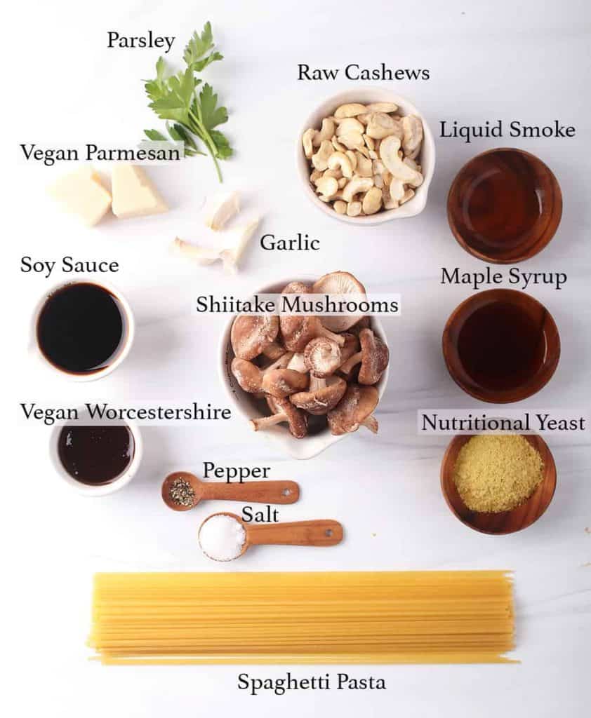 mise en place for vegan pasta carbonara recipe - spaghetti, mushrooms, nutritional yeast, liquid smoke, maple syrup, soy sauce, worchestershire, raw cashews, garlic, vegan parmesan, parsley