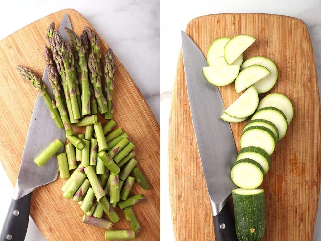 Sliced asparagus and zucchini on a cutting board