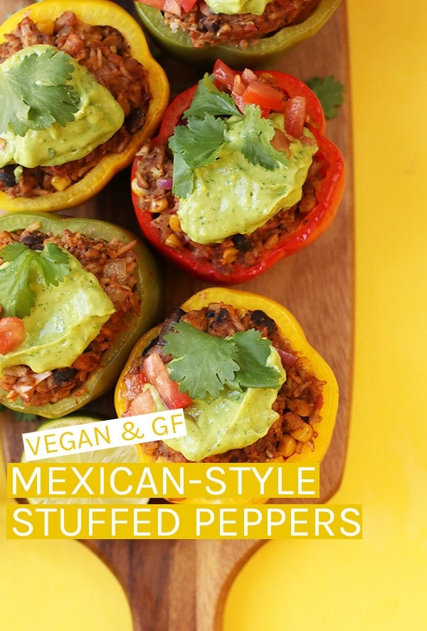 These Mexican-Style Vegan Stuffed Peppers are filled with tempeh, corn, beans, and spices  and topped with a homemade avocado cream for a delicious healthy gluten-free meal. #vegan #glutenfree #glutenfreerecipes #stuffedpeppers #vegandinner