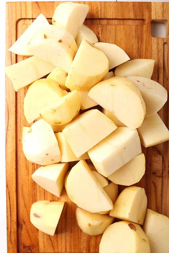 Chopped russet potatoes on cutting board