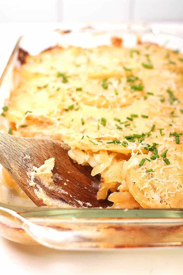 Vegan Scalloped Potatoes with serving spoon