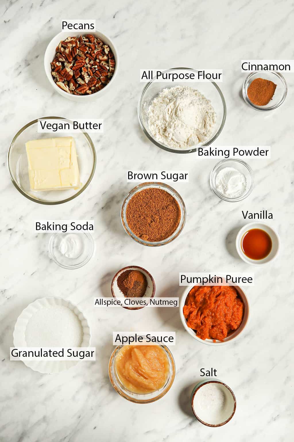 Ingredients for coffee cake measured out and placed on a marble countertop 