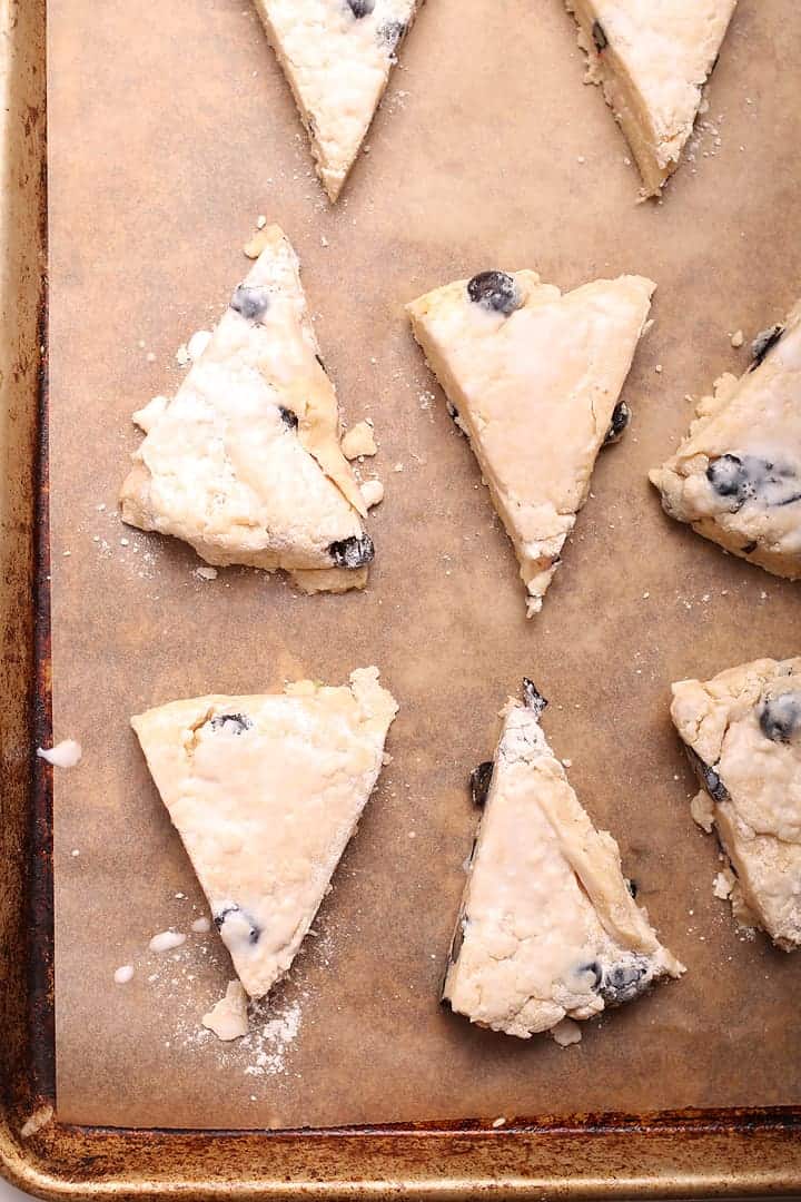 Unbaked vegan scones on a baking sheet