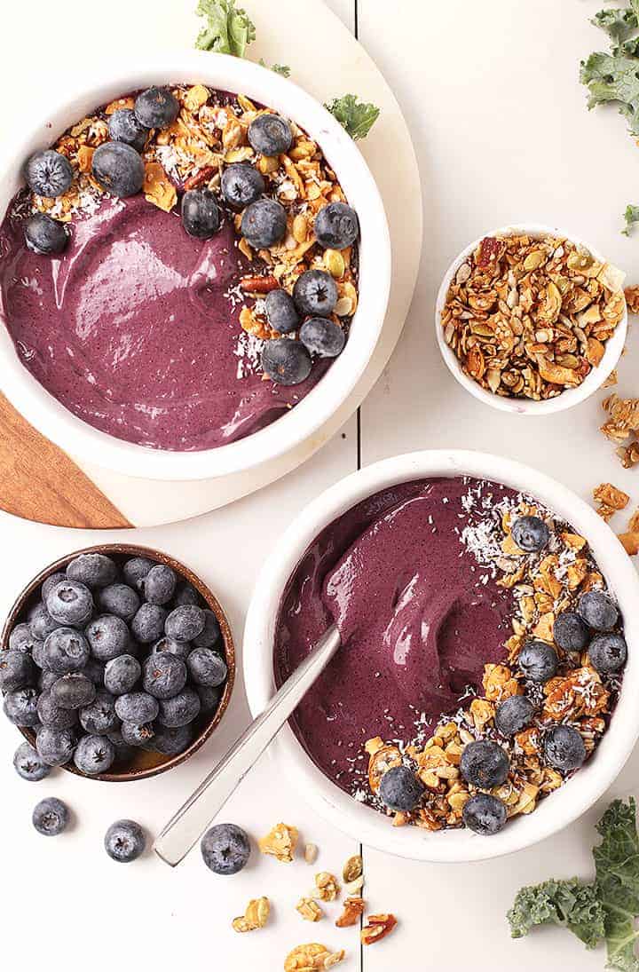 Two vegan blueberry smoothie bowls