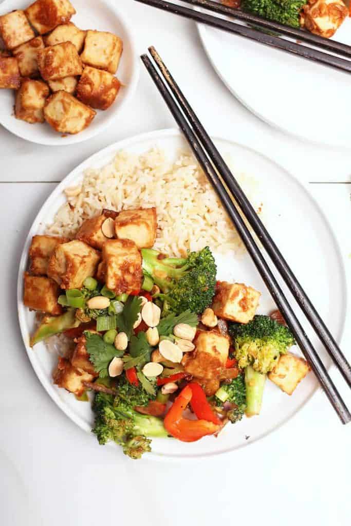 Tofu Stir Fry on white plate with chopsticks