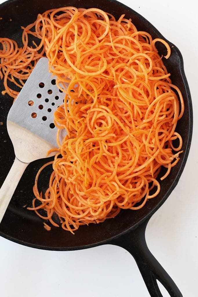 Sautéed Sweet Potato Noodles in a cast iron skillet