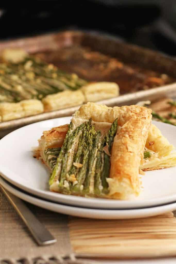 Finished asparagus tart on a white plate