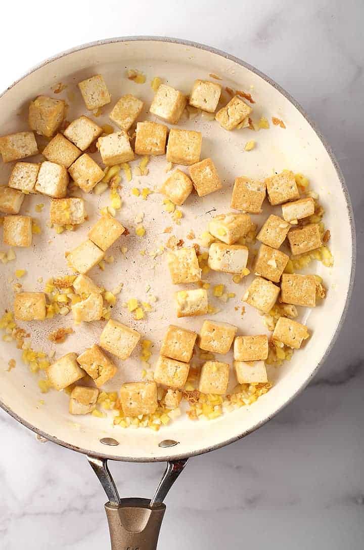 Tofu and garlic in a sauté pan