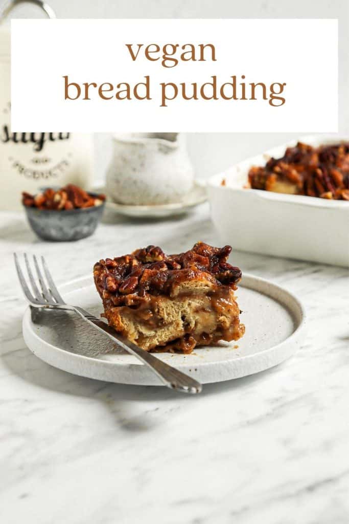 vegan bread pudding on white plate with fork and pecans