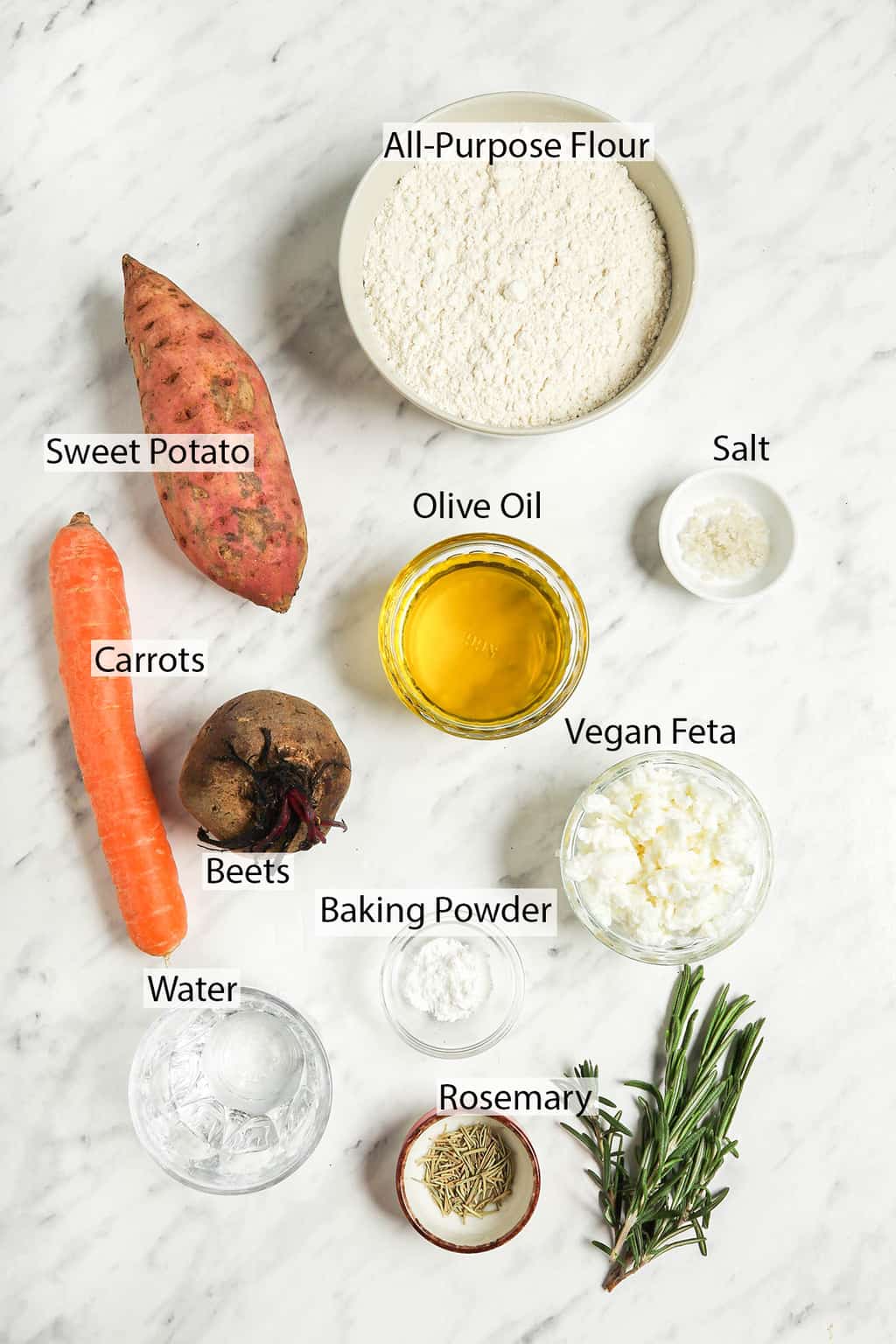 Ingredients for vegan galette measured out and placed on a marble countertip. 