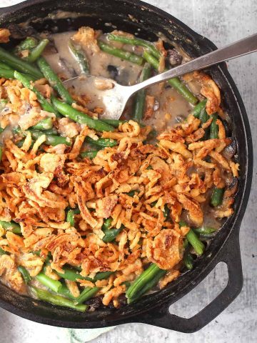 Finished green bean casserole in a cast iron skillet