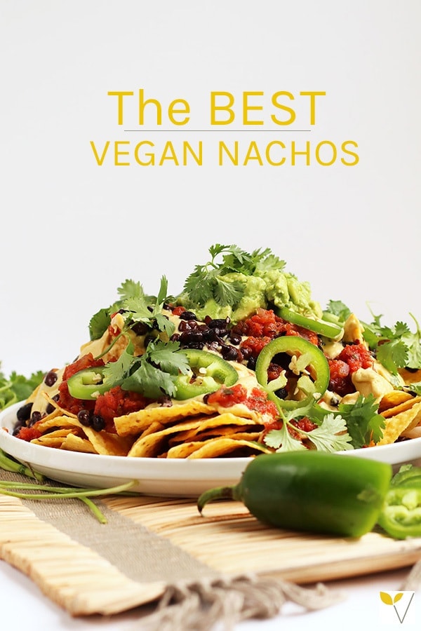 These Homemade Vegan Nachos are made with easy guacamole, vegan queso, and all the fixings for a delicious gluten-free party dish. #vegan #glutenfree #nachos #appetizers #partyfood #veganrecipes #mydarlingvegan