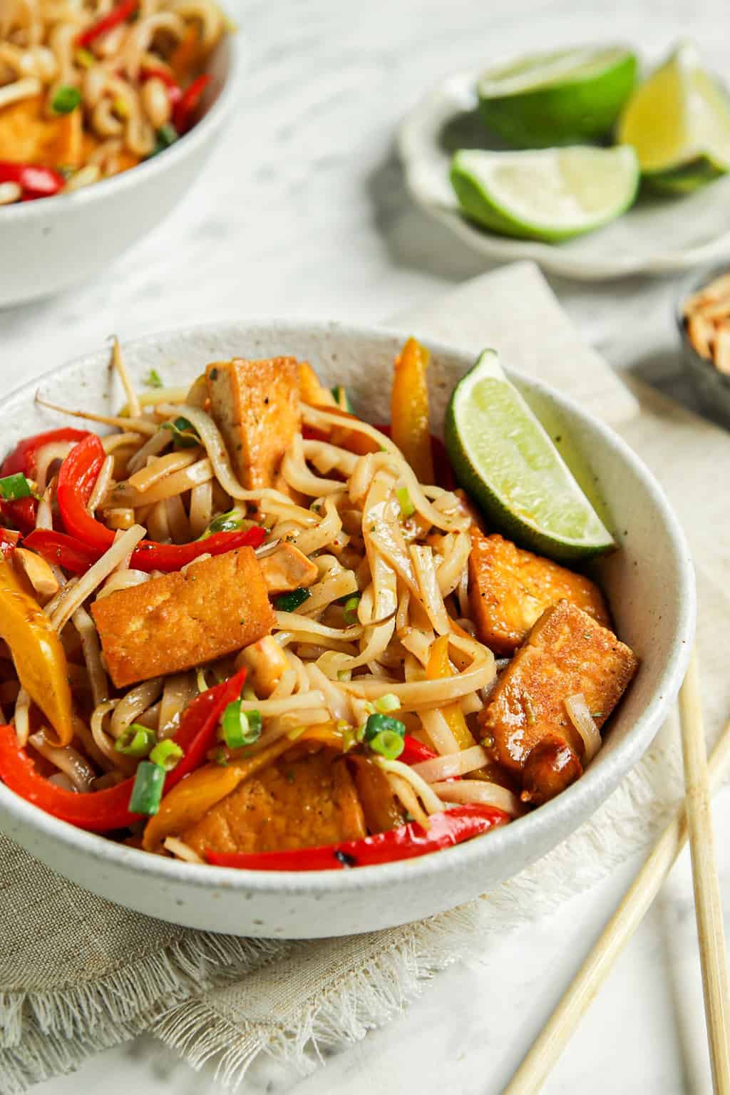 one bowl of vegan pad Thai with lime and tofu