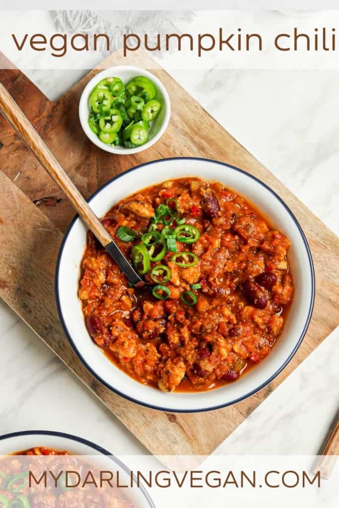 one bowl of vegan pumpkin chili in white bowl with Pinterest text