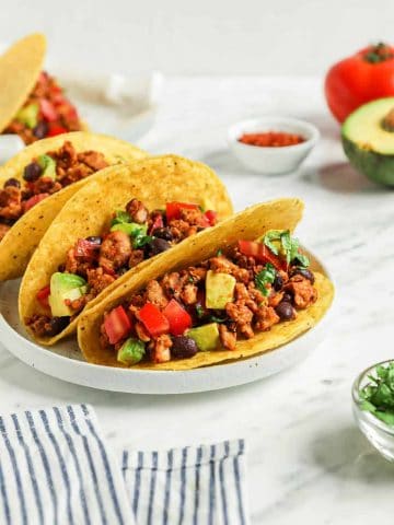 three tacos on plate