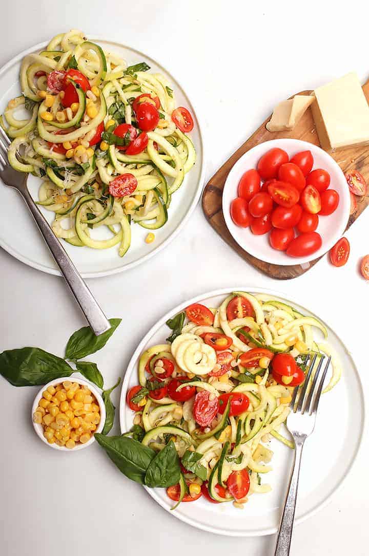 Zucchini salad on two white plates