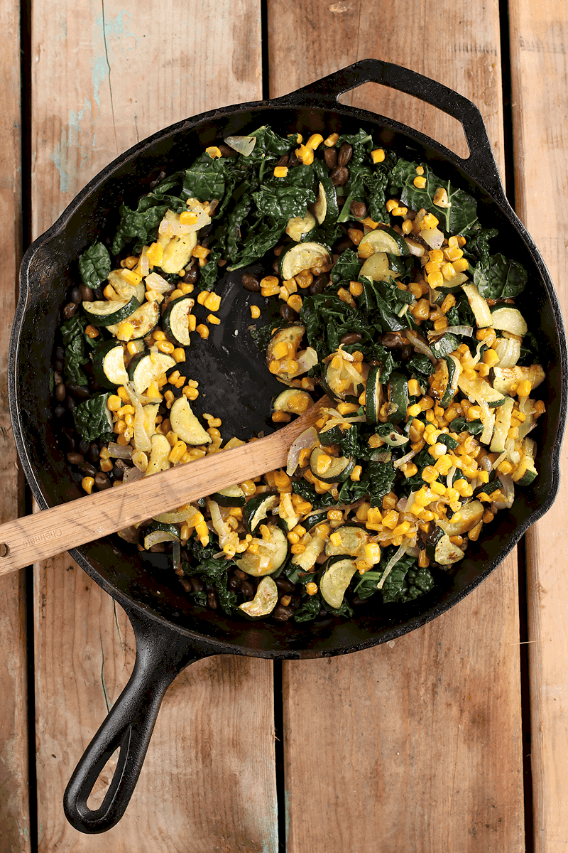 Sautéed kale and corn in skillet