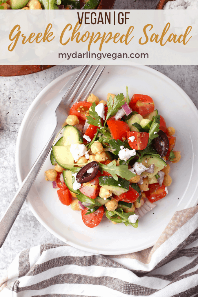 This Greek Chopped Salad is made with chickpeas, tomatoes, cucumbers, and olives all tossed in fresh lemon juice and olive oil for a refreshing vegan and gluten-free light meal or side dish. Made in just 10 minutes!